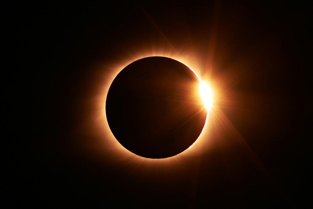 An image of a solar eclipse, with the sun partially obscured by the moon.
